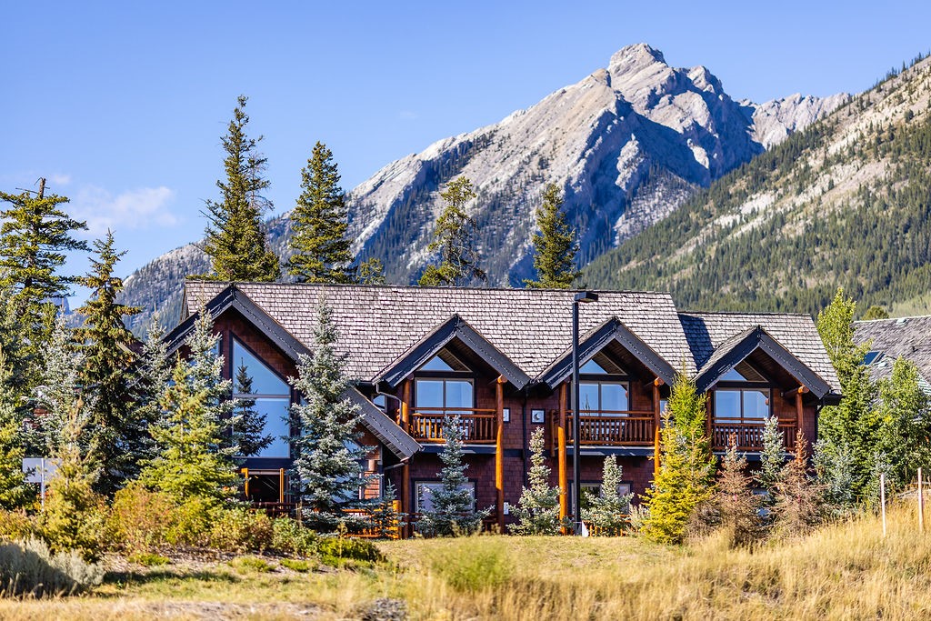 Winter view of A Bear & Bison Inn with Three Sisters Mountains backdrop