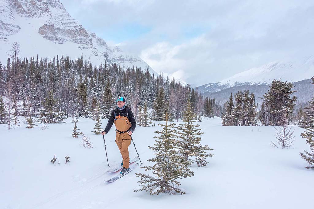 Backcountry skiing in Skoki Valley with mountain views